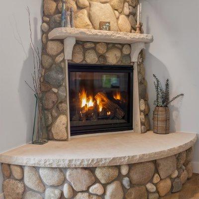 Fireplace in living room with local stone hearth and chimney